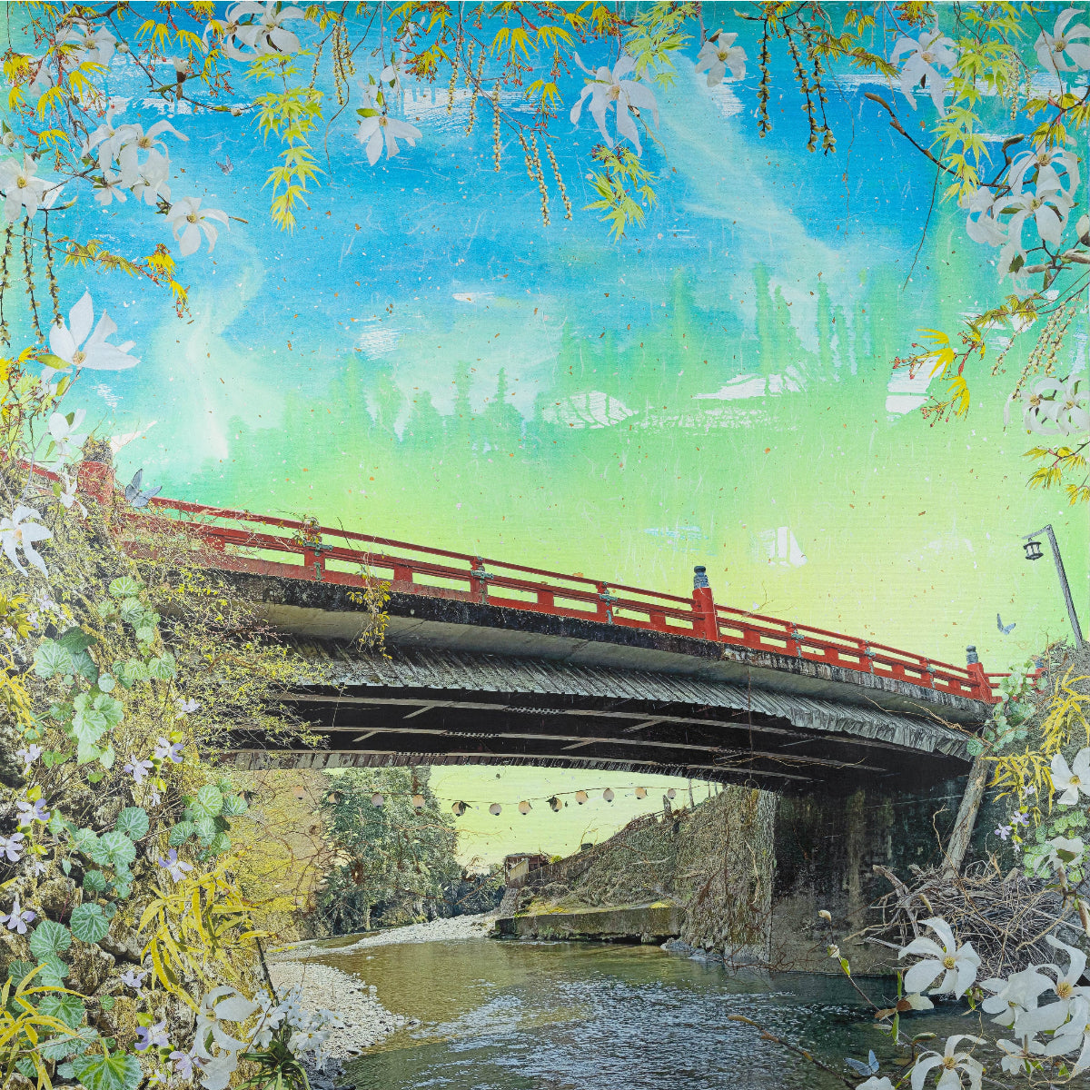 Traditional Japanese bridge with cherry blossoms and a blue sky